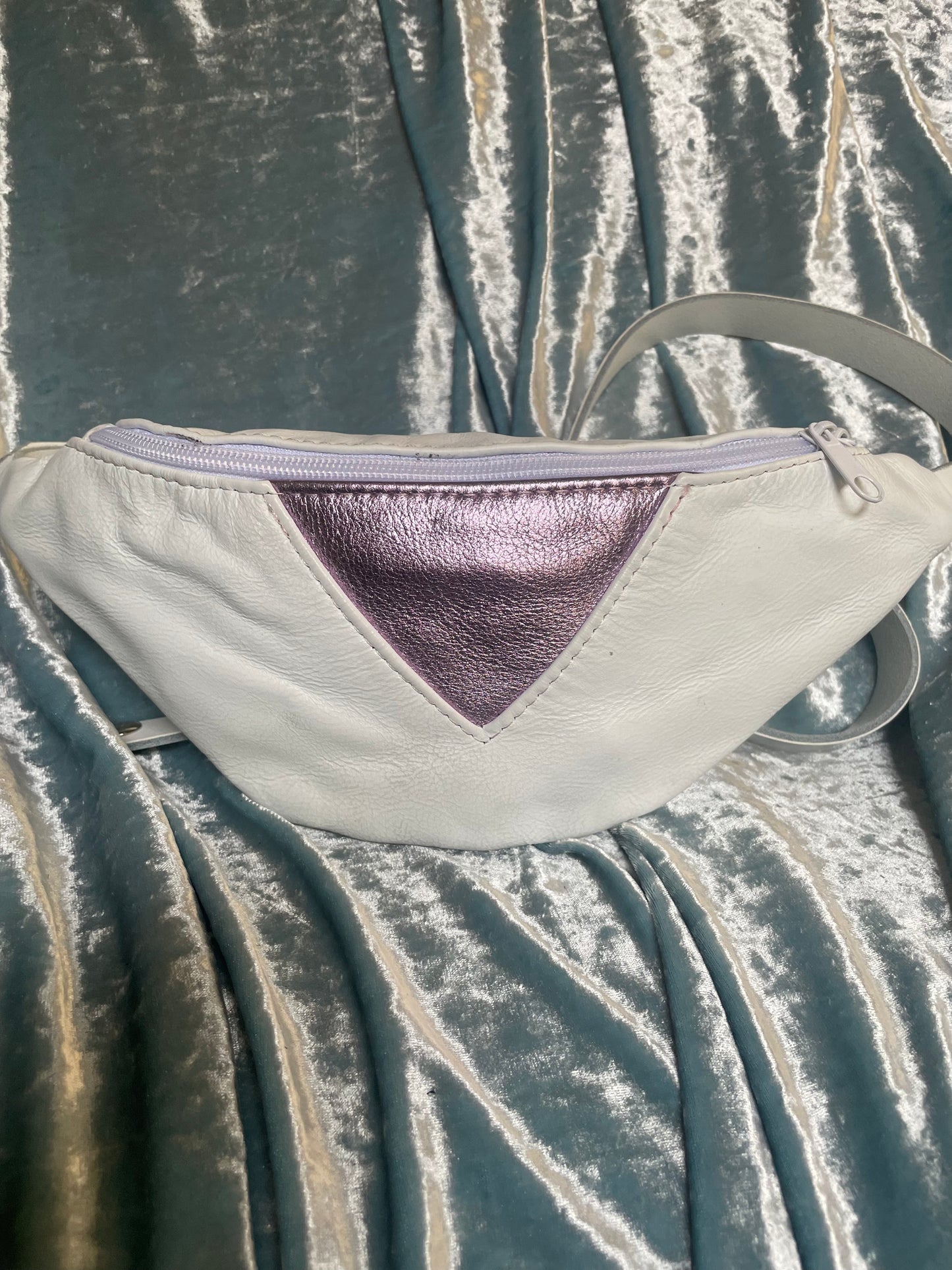 White fanny pack with metallic lavender triangle