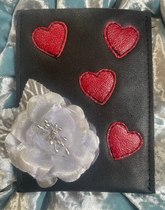 black with red hearts and a metallic silver rose